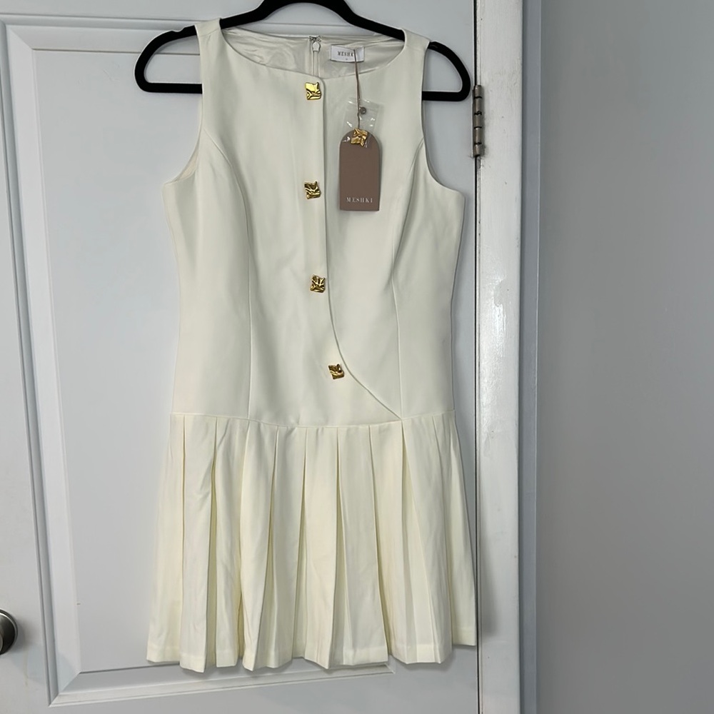 MACKENZIE Sleeveless Pleated Mini Dress – Elegant & Modern